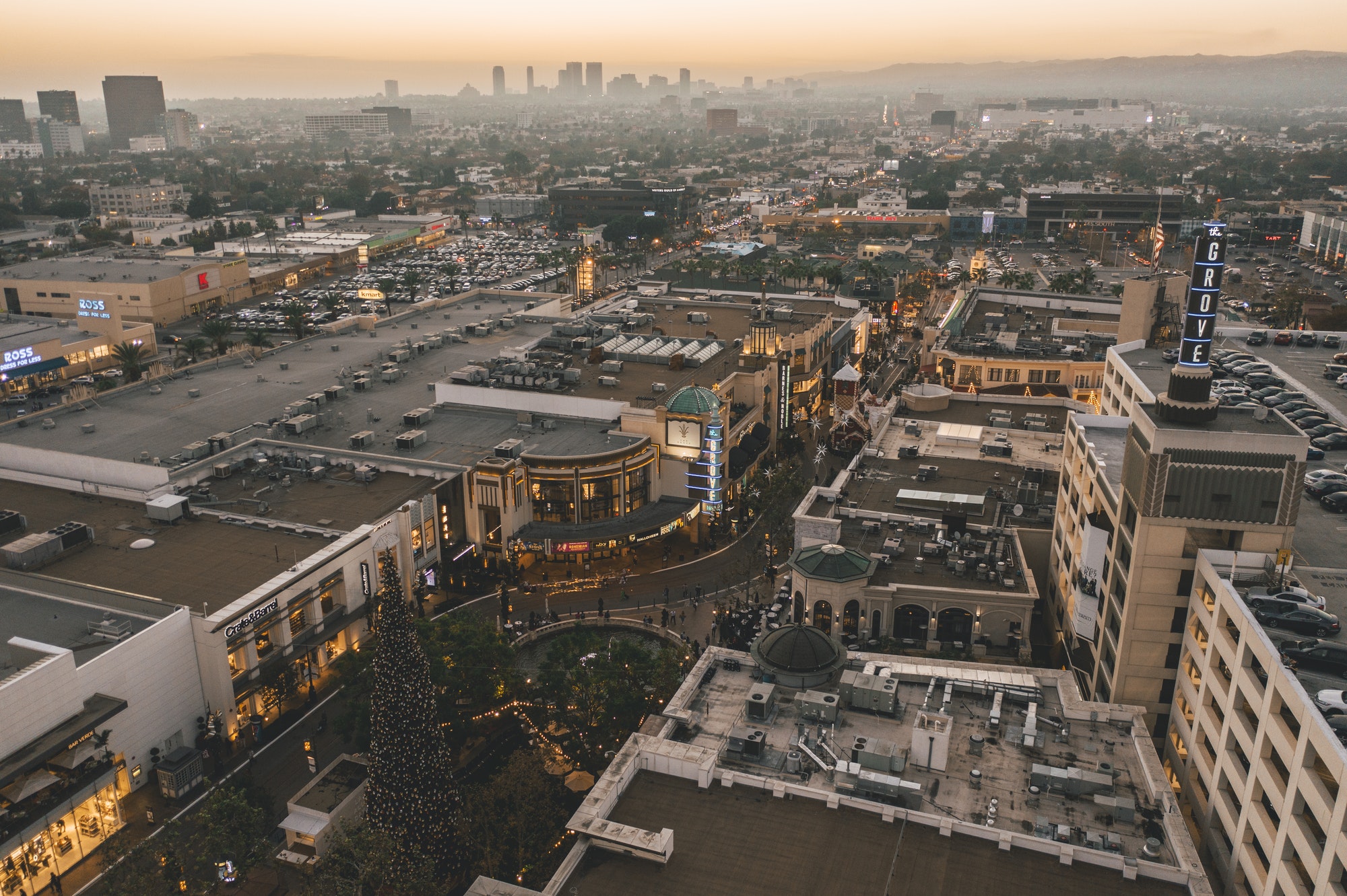 The Grove Shopping Center in Los Angeles at Sunset with Shops and Hollywood Skyline in the distance